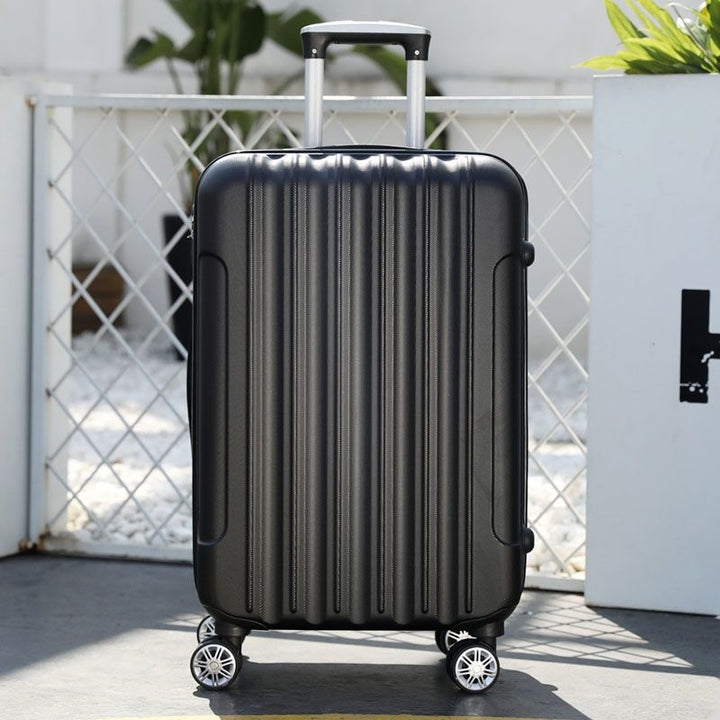 Hard shell suitcase with 360-degree wheel system and integrated safety feature Bowlift