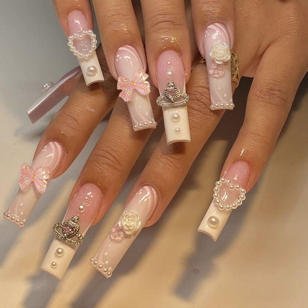 Artful nail tips with pearl and bow motifs Bowlift