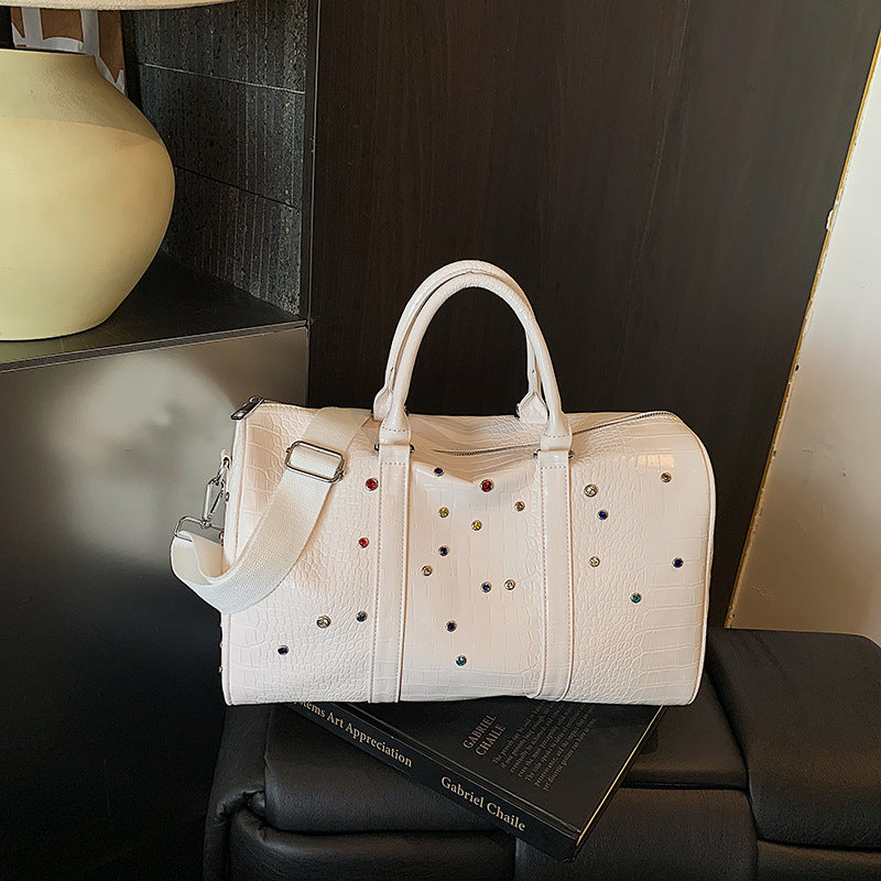 Fashionable travel bag with structured surface and versatile interior Bowlift