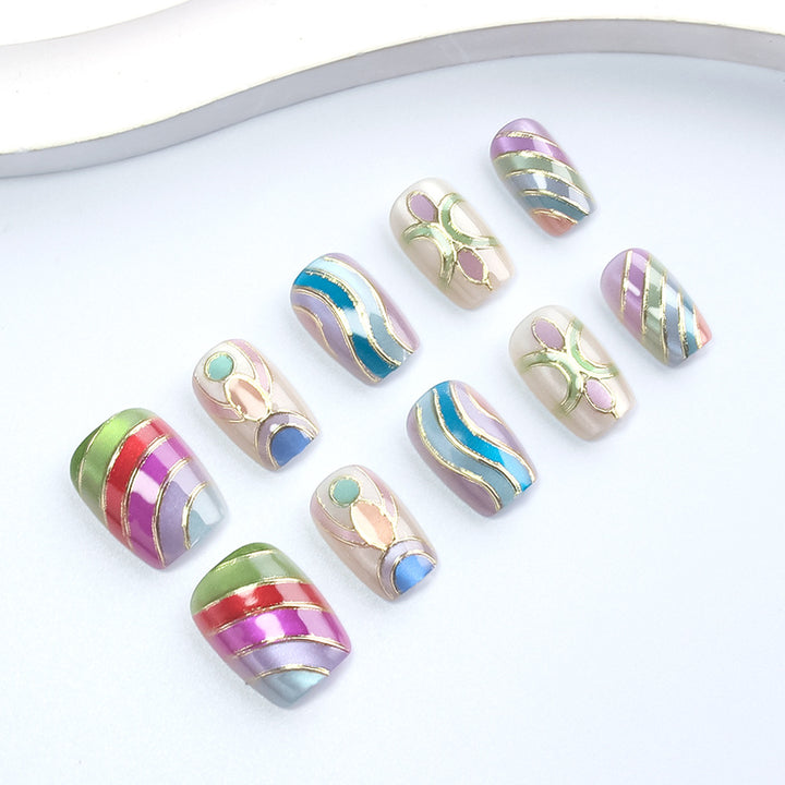 Artistic Press-On Nail Set with Gold Accents Bowlift