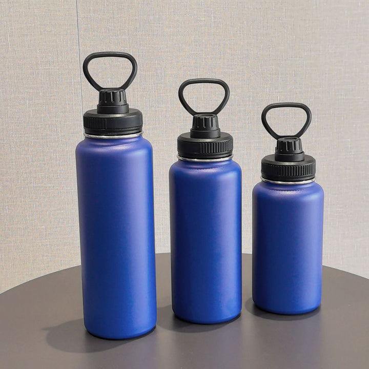 Insulated stainless steel water bottle with wide mouth and silicone carry loop Bowlift