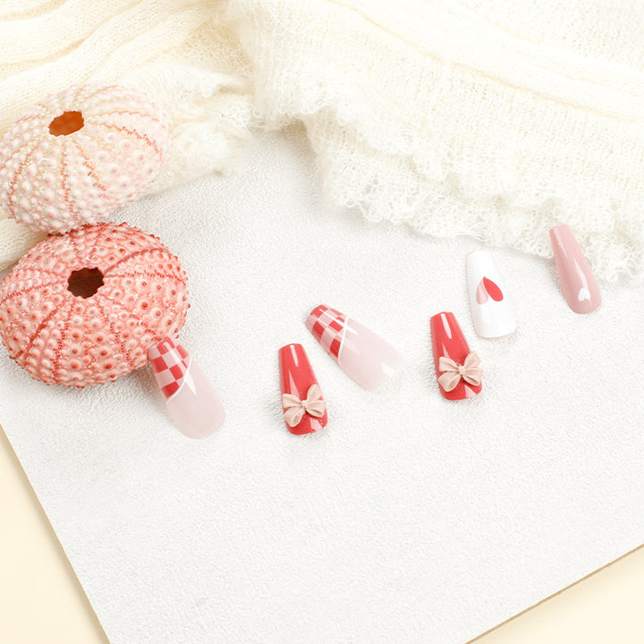 Artful nail extensions with playful designs and romantic accents Bowlift