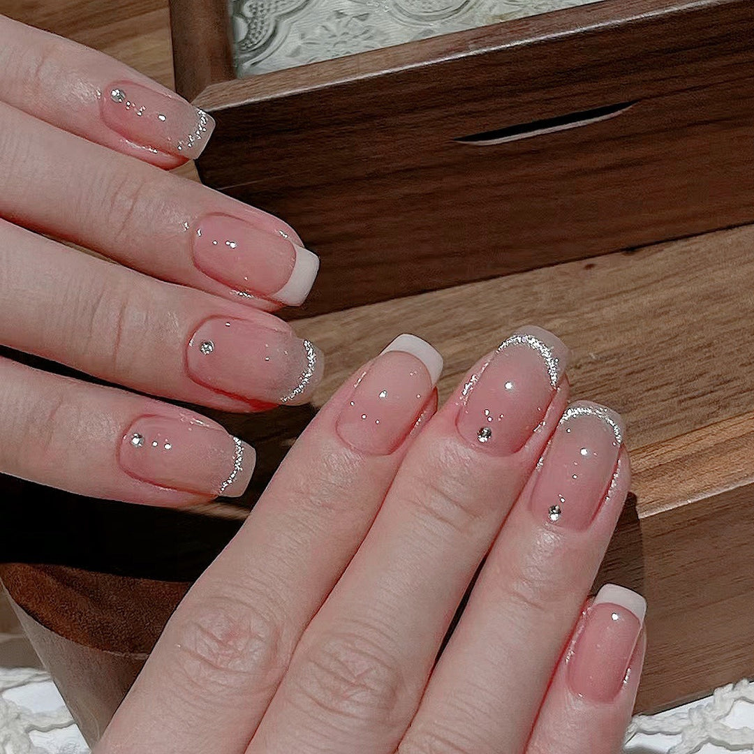 Glamorous artificial nails with filigree rhinestone details Bowlift