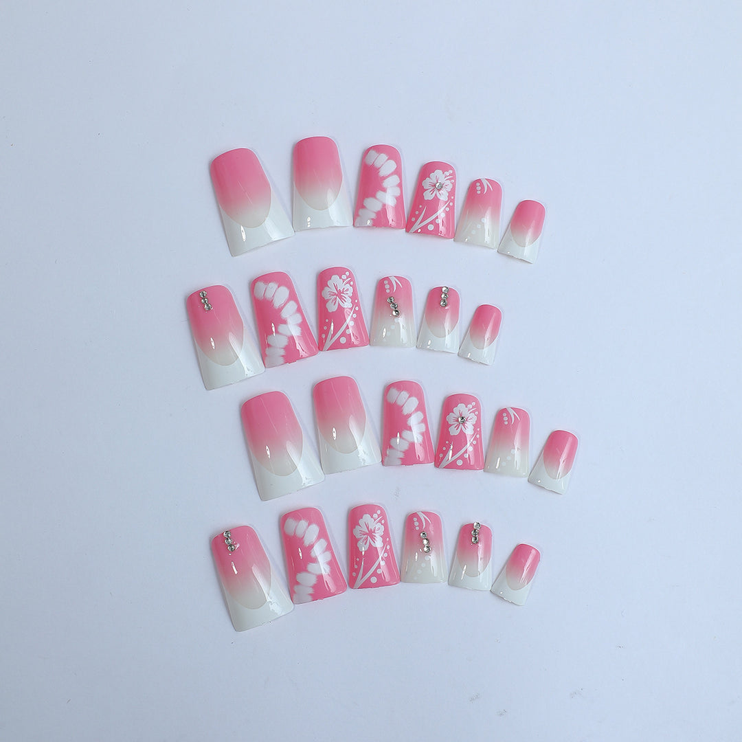 Acrylic nail set with elegant floral designs and glitter accents Bowlift