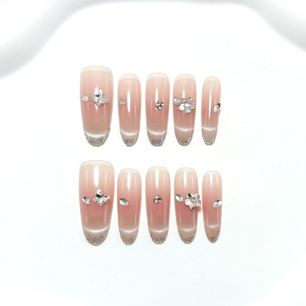 Glamorous artificial nails with glitter decorations Bowlift