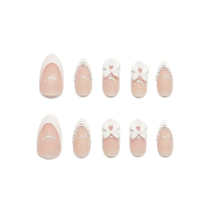 Artistic Press-On Nail Design with Bow Accents Bowlift