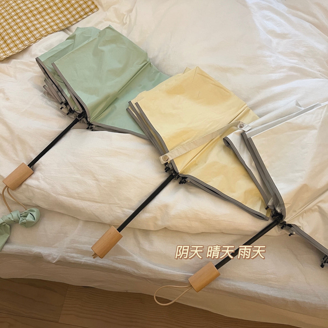 Women's automatic folding umbrella with elegant design and ergonomic wooden handle Bowlift
