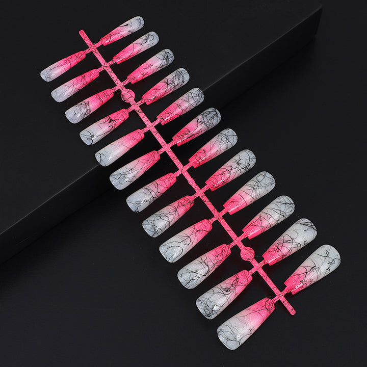 Artificial nails in modern ombre design with marbled accents Bowlift