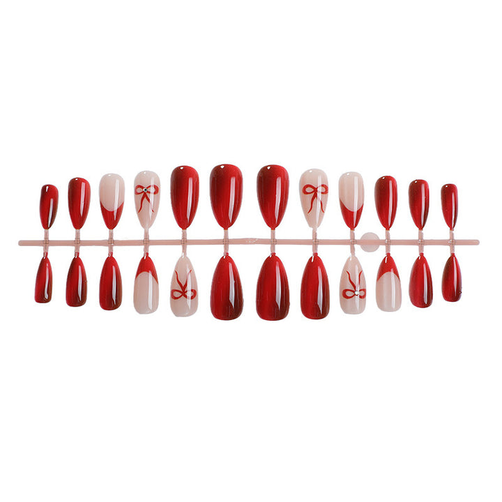 Designer artificial nails with elegant bow decoration Bowlift