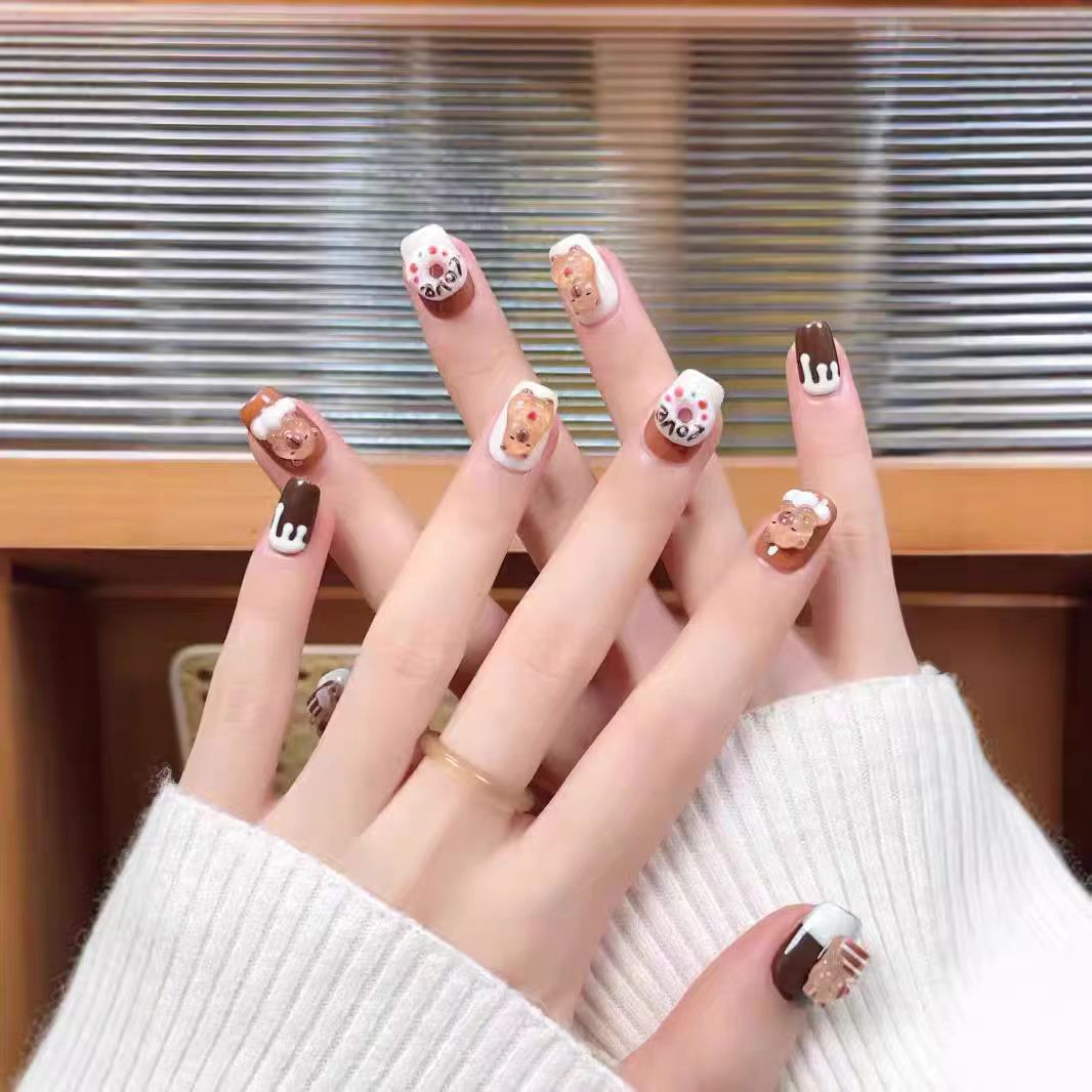 Decorative Press-On Nail Extensions with Bow and Rhinestone Accents Bowlift