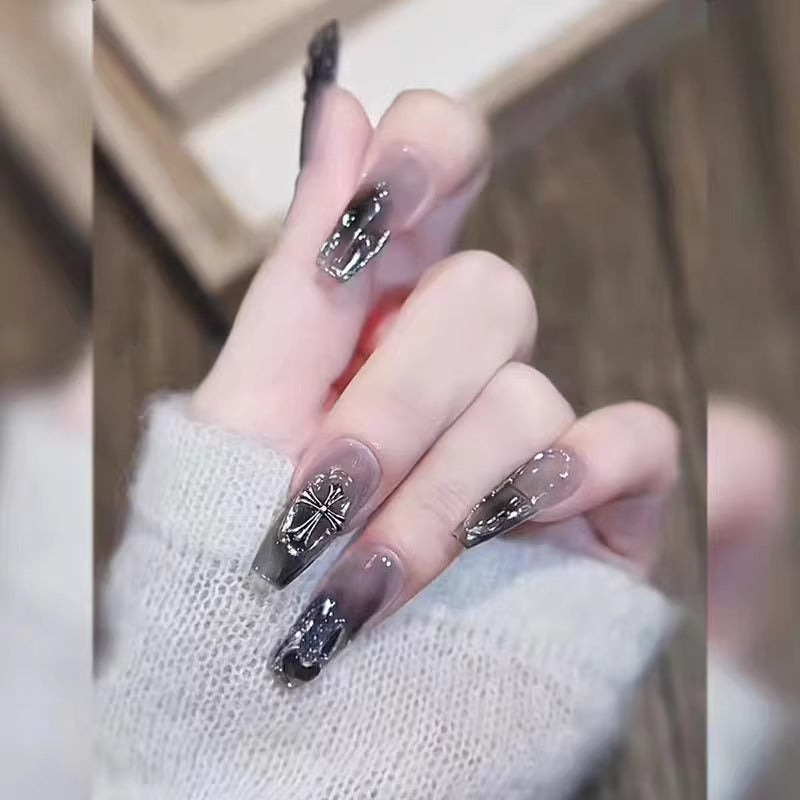 Glamorous artificial nails with heart design and glittering accents Bowlift