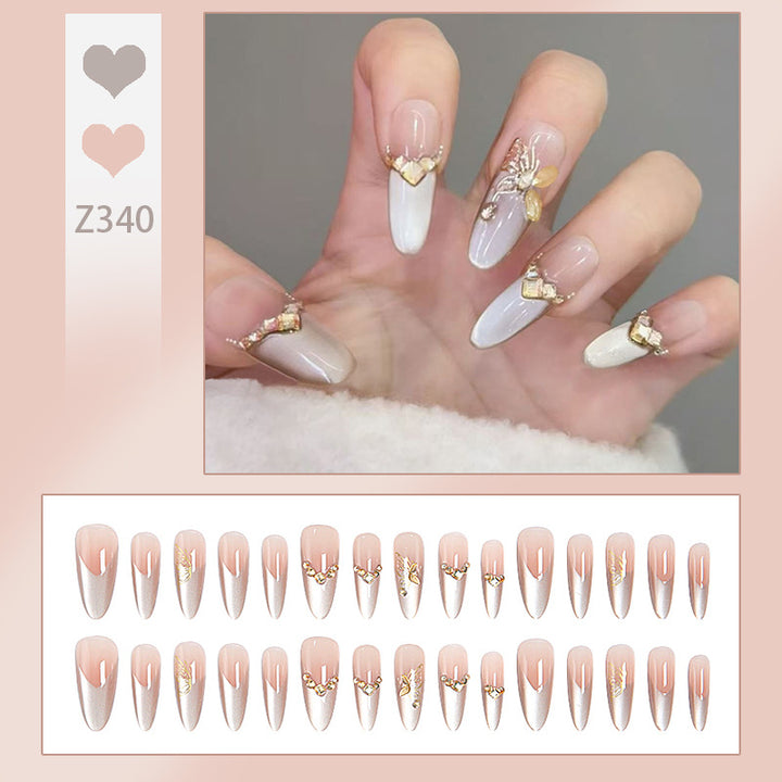 Glamorous art nails with elegant golden details Bowlift