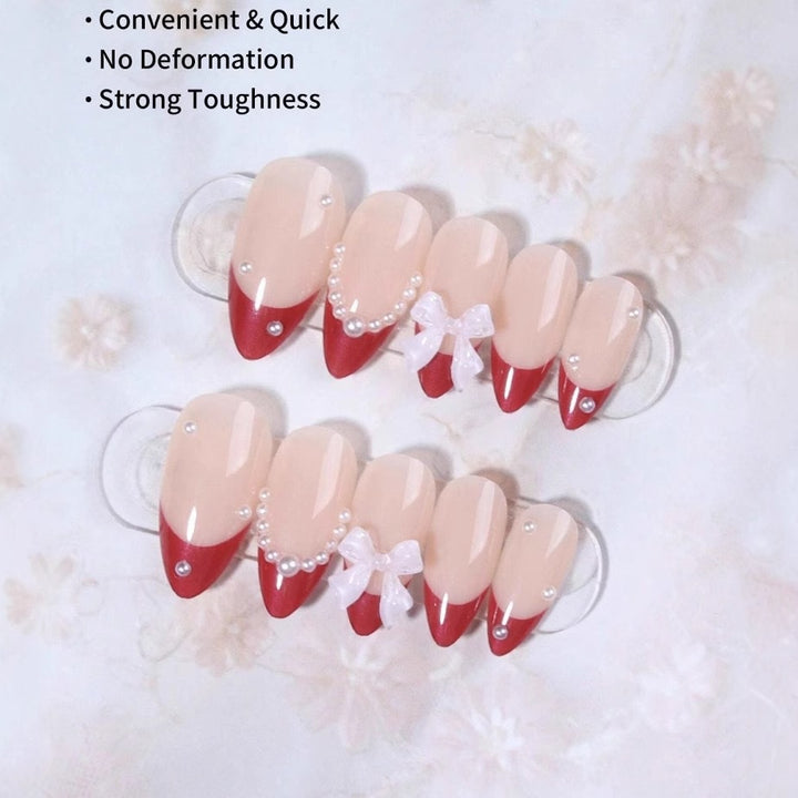 Artificial nail set with glamorous rhinestone and bow decorations Bowlift