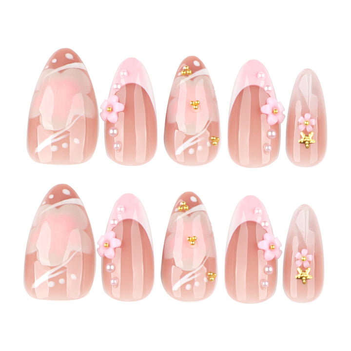 Artful nail extensions with floral patterns and glitter accents Bowlift