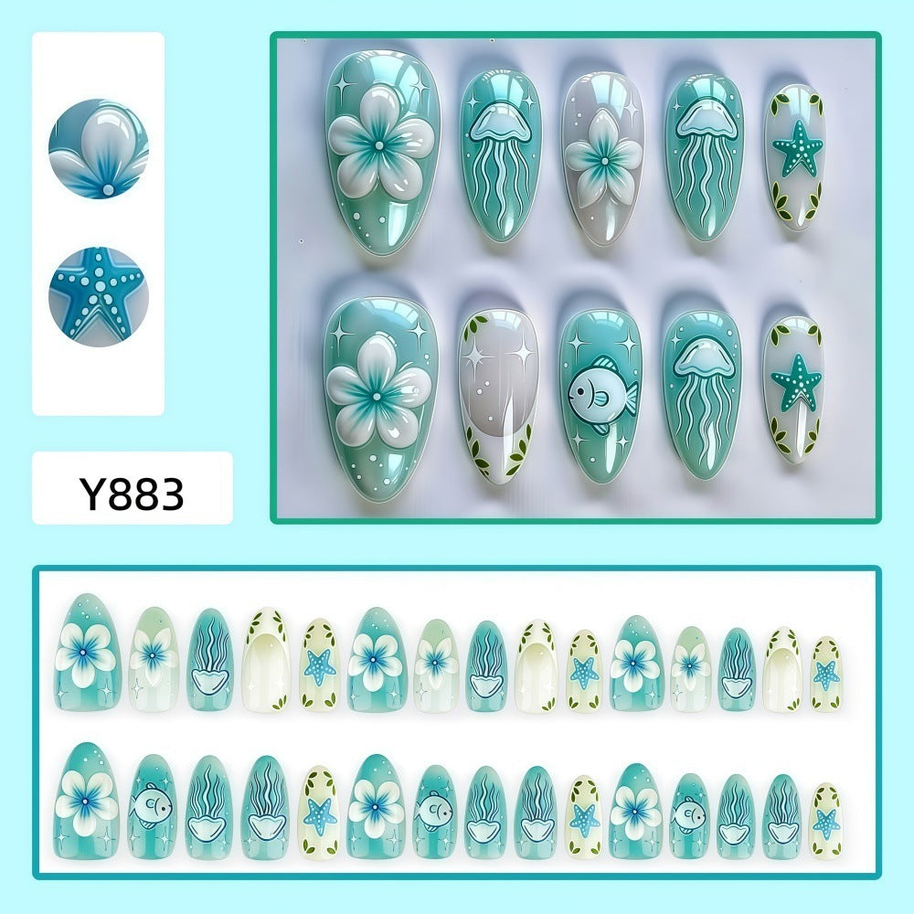 Artificial nails in a maritime design with colorful shell and water motifs Bowlift