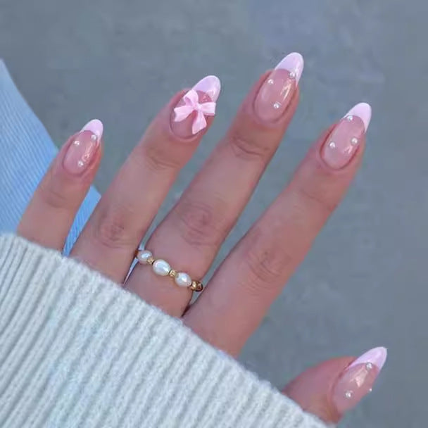 Artificial nail set with shimmering 3D bows and elegant pearl accents Bowlift
