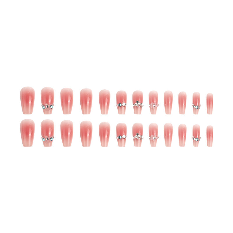 Artificial nail set with glamorous 3D decorations and shimmering accents Bowlift