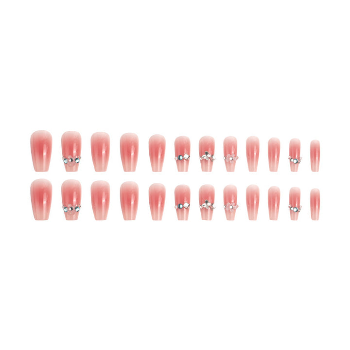 Artificial nail set with glamorous 3D decorations and shimmering accents Bowlift