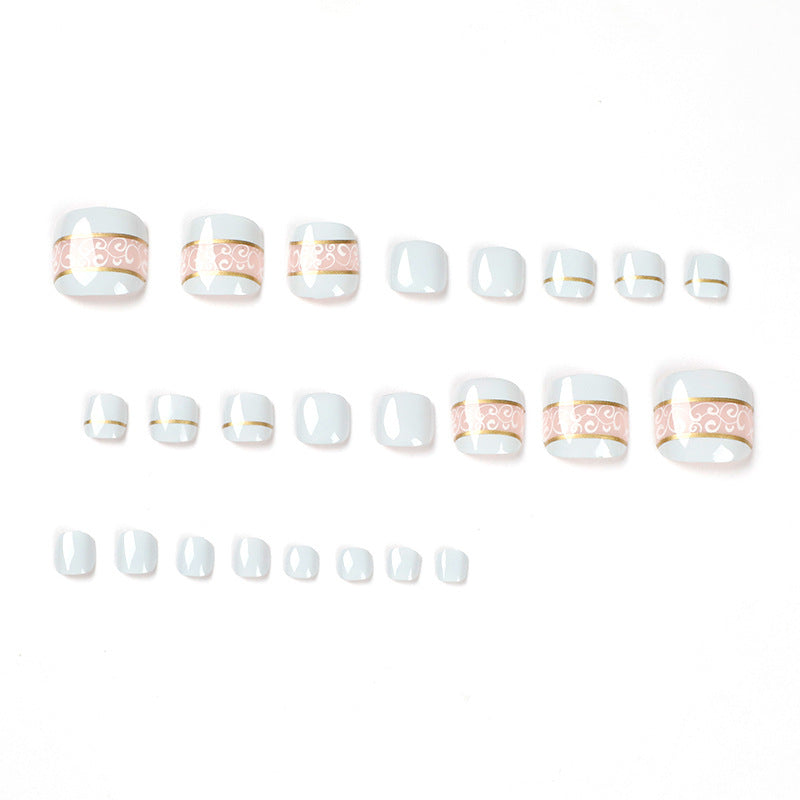 Artful toenail art with elegant golden accents Bowlift