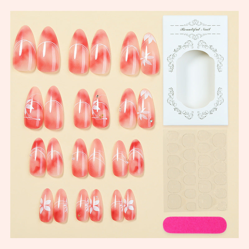 Acrylic nail set with elegant ombre design and floral accent Bowlift