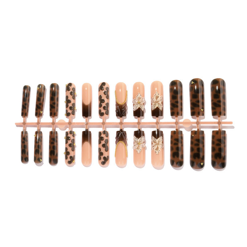 Nail design with floral accents and elegant details Bowlift