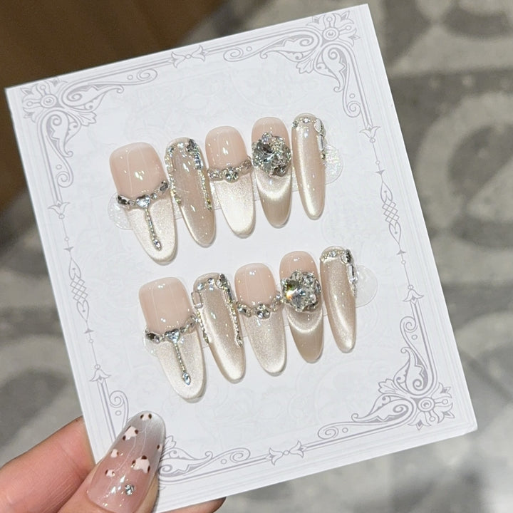 Glamorous nail tips with rhinestone and glitter effects Bowlift