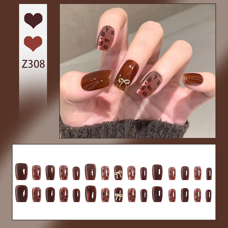 Nail set with elegant leopard pattern and luxurious accents Bowlift