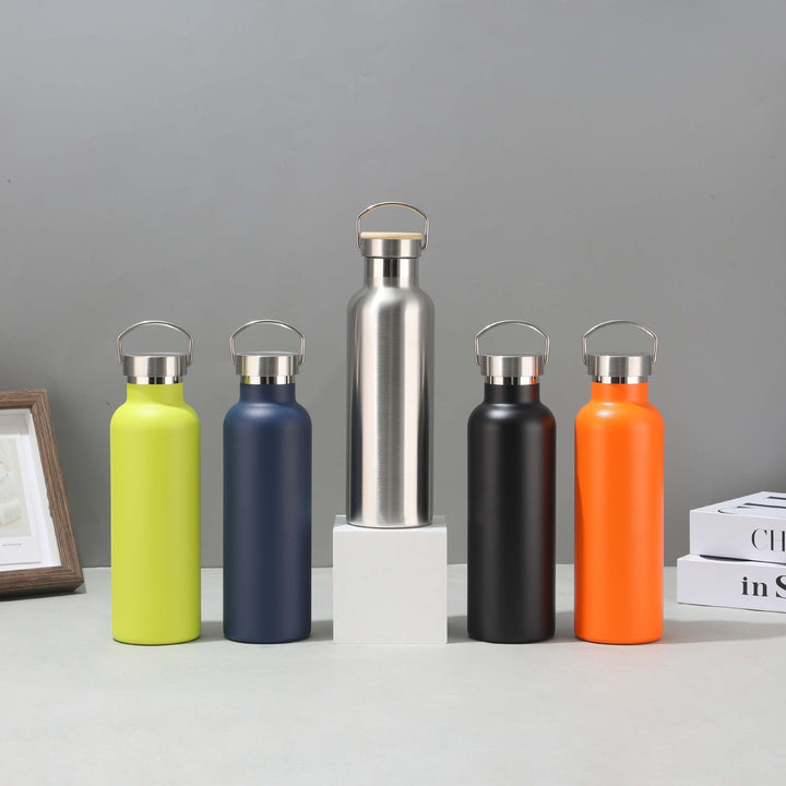Women's stainless steel insulated drinking bottle with sustainable bamboo lid Bowlift
