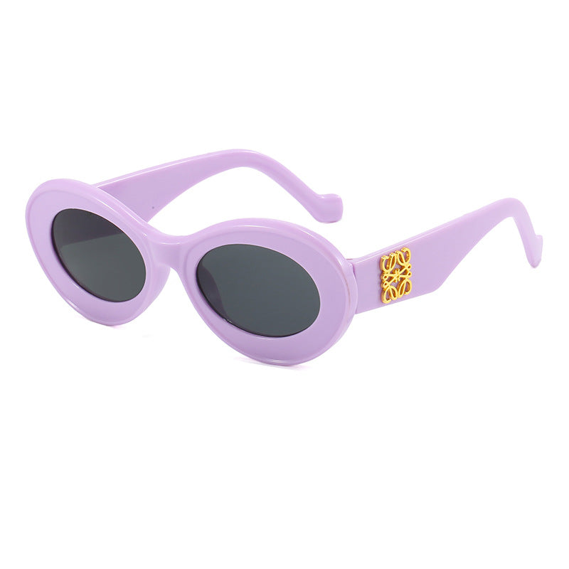 Women's fashionable sunglasses with oval frame and golden applications Bowlift