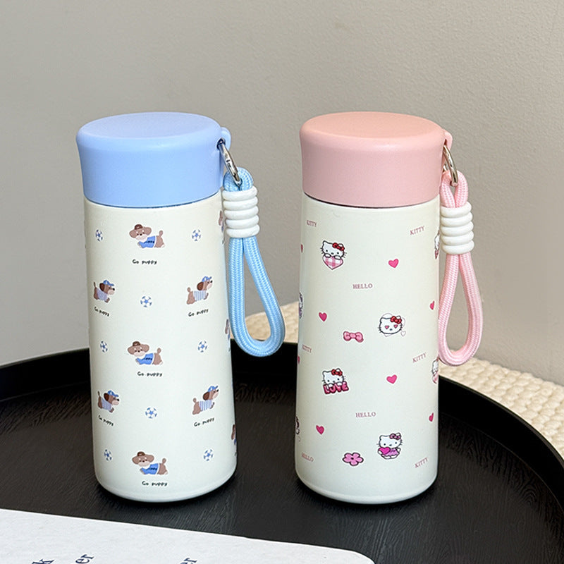 Women’s insulated drinking bottle with practical carrying strap and playful design Bowlift