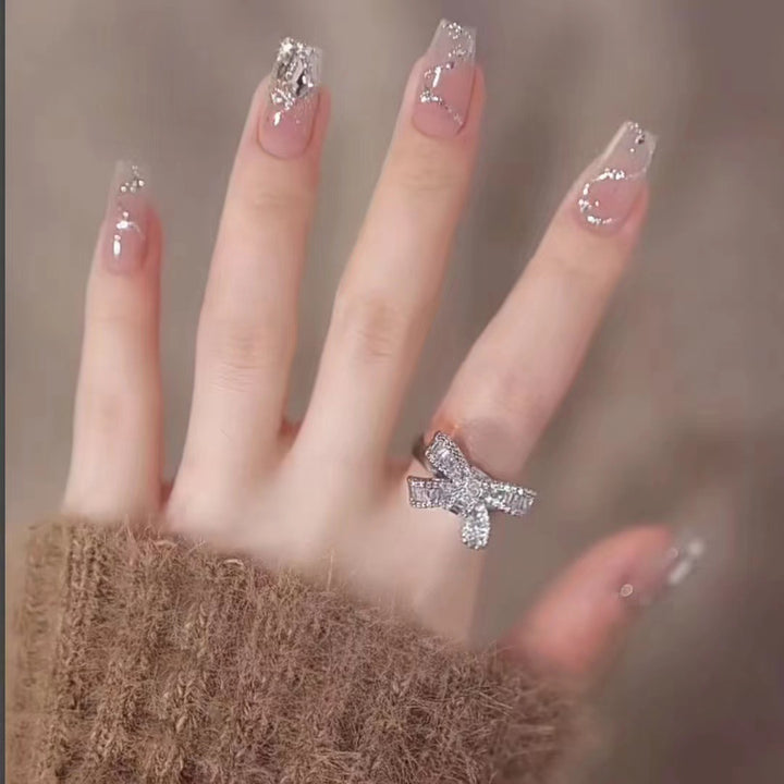 Glamorous artificial nails with glitter accents Bowlift