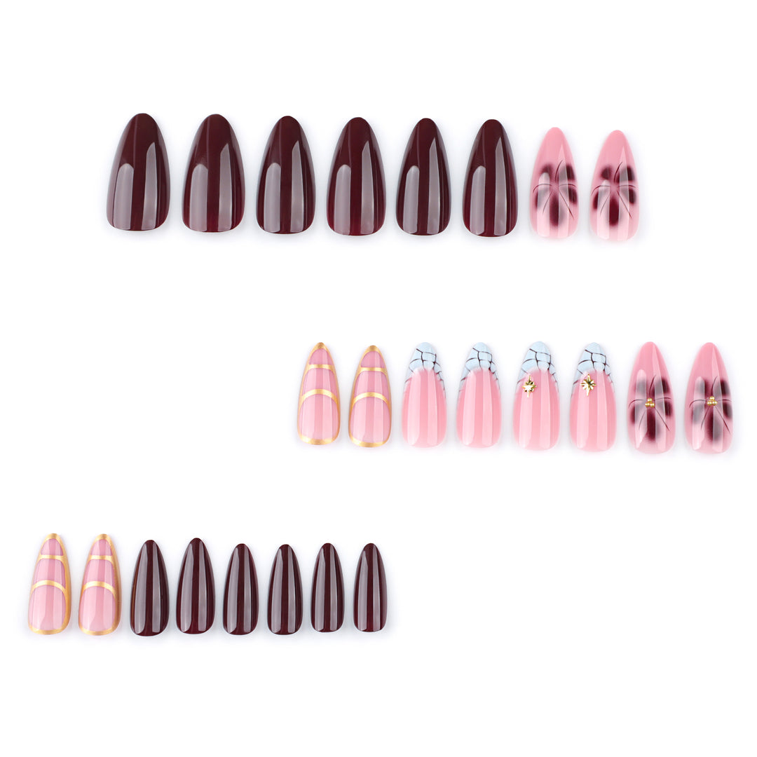 Artful Stiletto nails with gold accents and decorative floral designs Bowlift