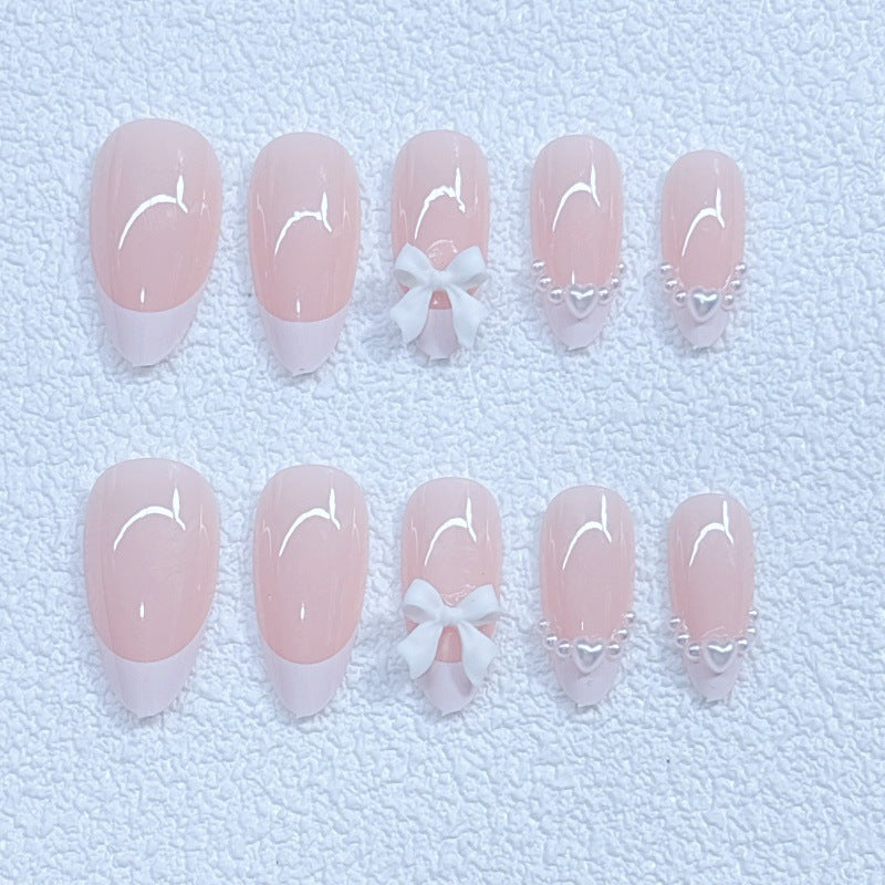 Elegant artificial nails with curved tips and decorative bows Bowlift