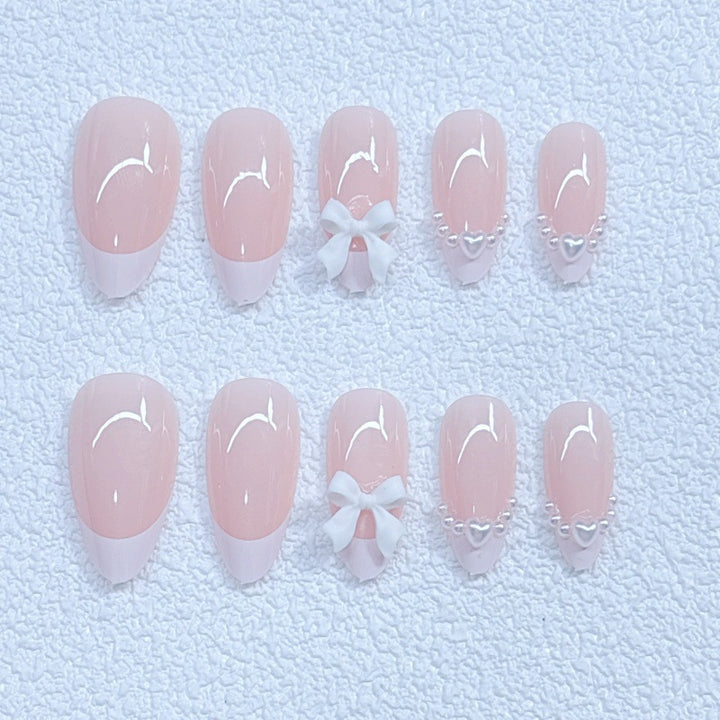 Elegant artificial nails with curved tips and decorative bows Bowlift