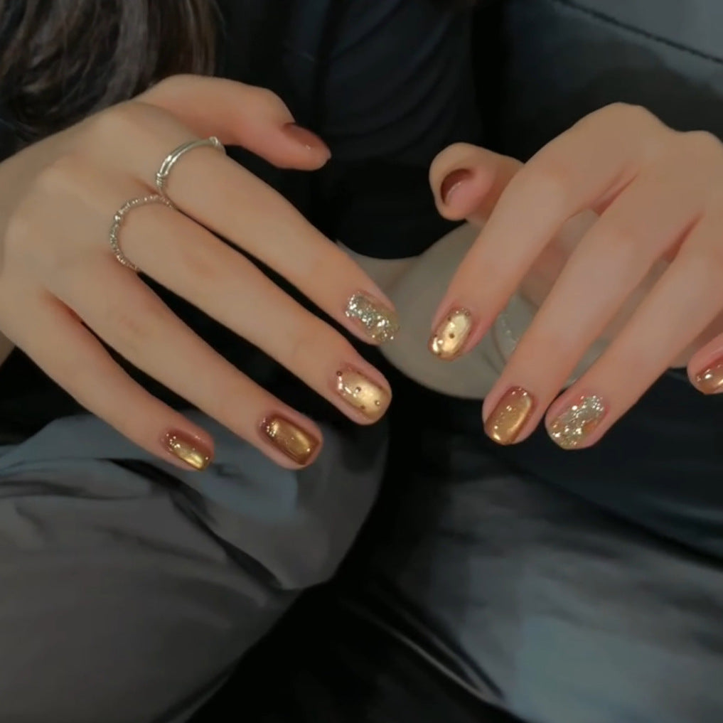 Elegant artificial nails with shimmering effects and sparkling accents Bowlift