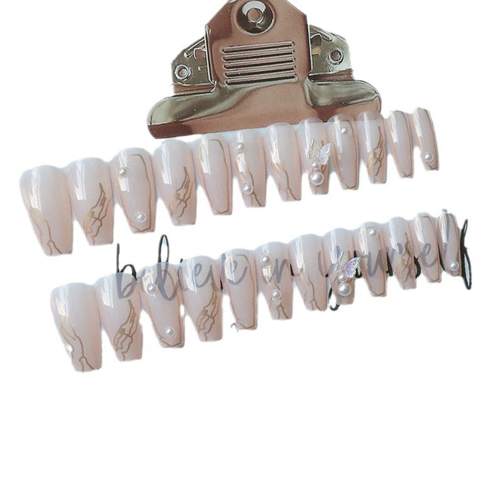 Artificial nails with elegant bows and pearl decorations Bowlift