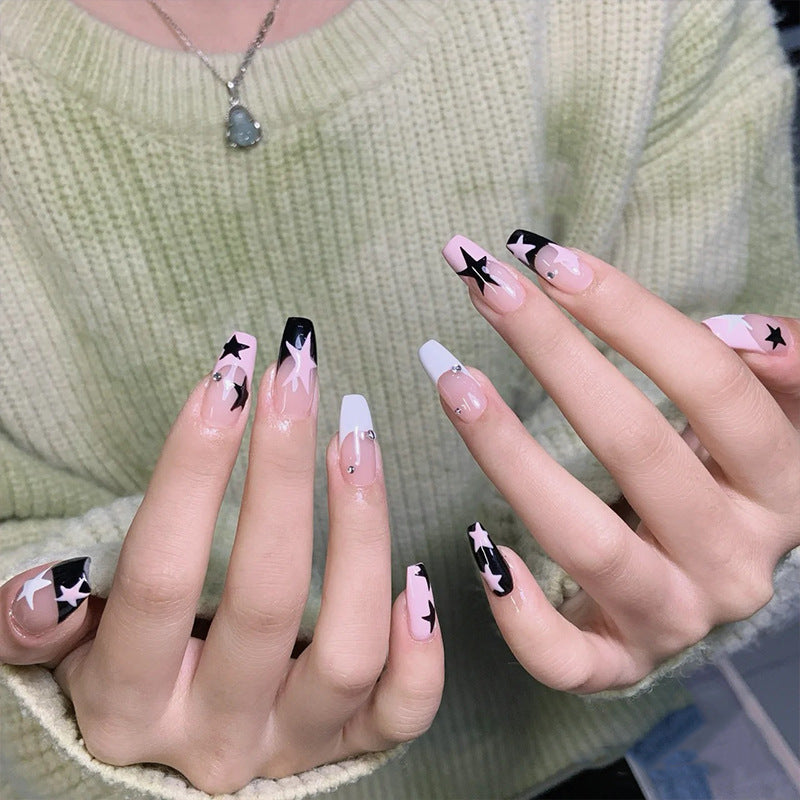 Artificial nail set with glamorous star design and sparkling accents Bowlift