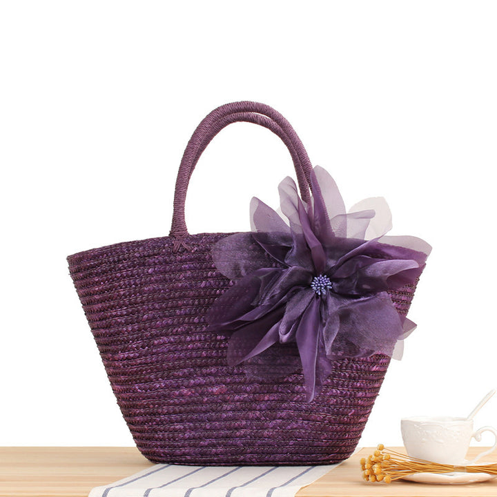 Elegant straw bag with floral accents Bowlift