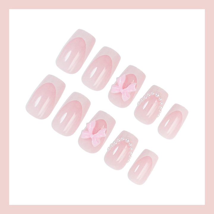 Artifical nail set with romantic bows and elegant accents Bowlift