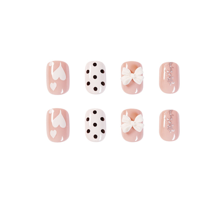 Artful nail art with delicate flower and heart motifs Bowlift