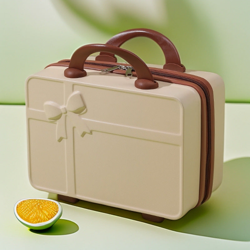 structured hard-shell cosmetic travel case with embossed bow and dual top handles Bowlift