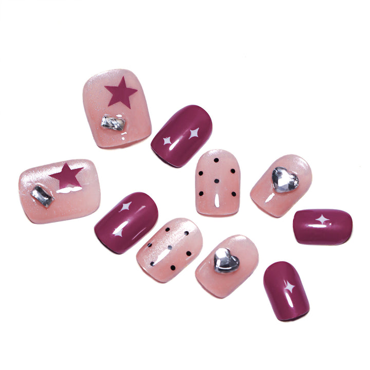 Artificial nail extensions with unique jewelry accents Bowlift