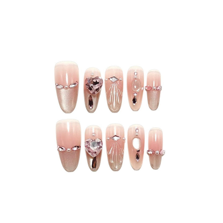 Artificial nails with sparkling heart and rhinestone accents Bowlift