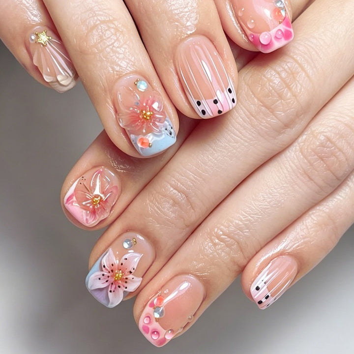 Artificial nail set with floral accents and glamorous decorations Bowlift