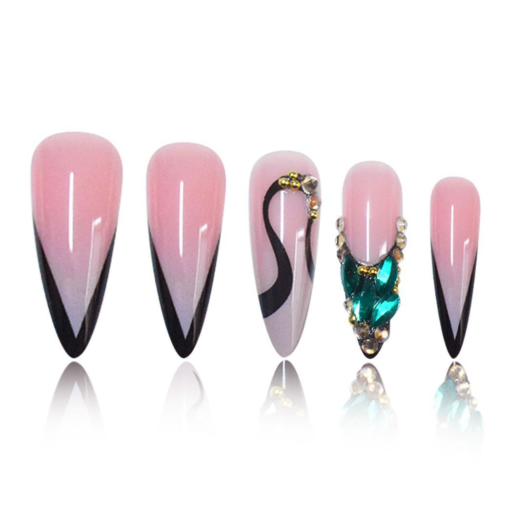 Elegant Stiletto Nail Enhancements with Gem Accents Bowlift