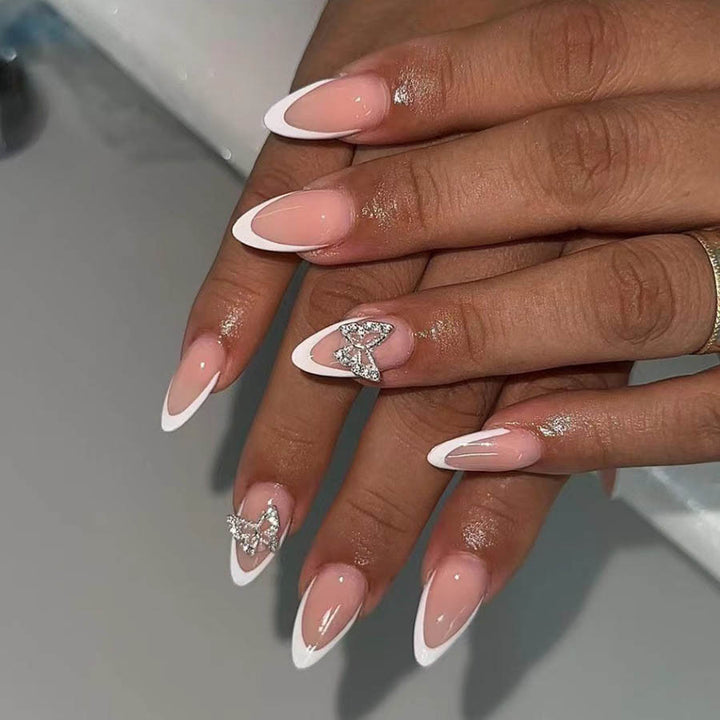 Artificial nail set with elegant French design and rhinestone-embellished accents Bowlift