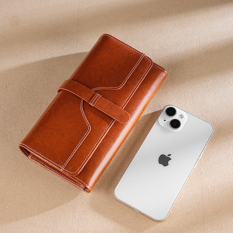 Premium leather long wallet clutch with strap closure and multiple card slots Bowlift