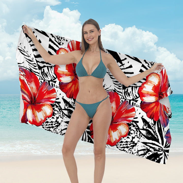 Beach towel with vibrant tropical plant motif Bowlift