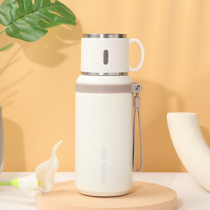 Women's insulated stainless steel drinking bottle with foldable cup Bowlift