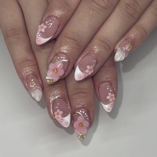 Artful nail extensions with floral patterns and glitter accents Bowlift